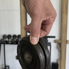 Pinch hold con discos — ejercicio de mano